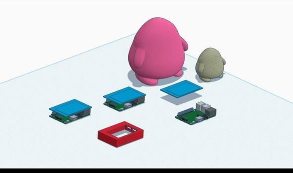The first 3D model of Lumi next to its circuit boards